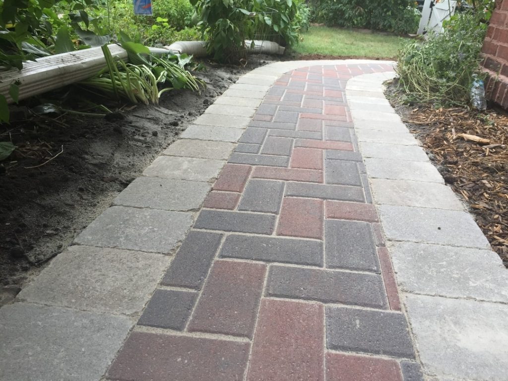Paved walkway with landscaping
