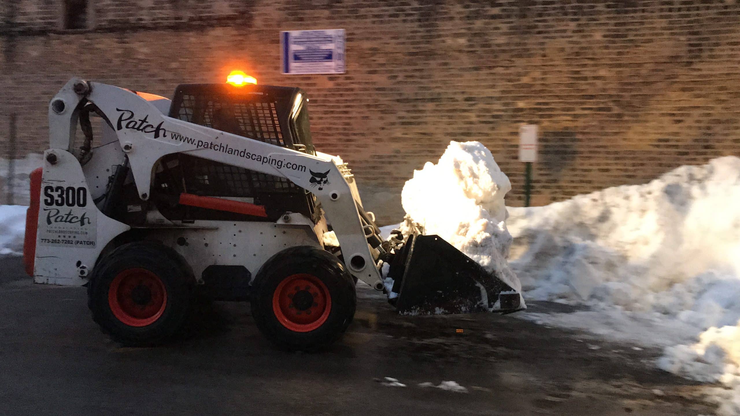 Bobcat clearing snow